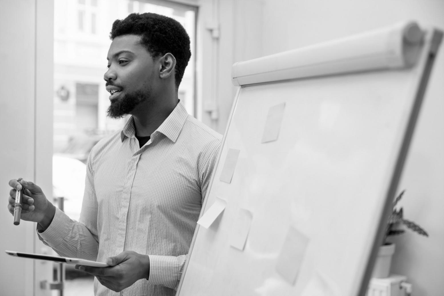 Students collaborating on practical financial planning exercises using real-world scenarios